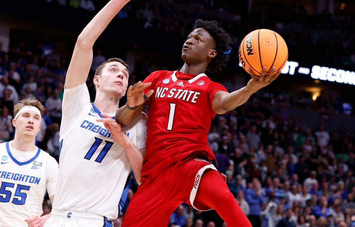N.C. State’s Jarkel Joiner (1) heads to the basket past Creighton’s Ryan Kalkbrenner (11) during the second half of Creighton’s 72-63 victory over N.C. State in the first round of the NCAA Tournament at Ball Arena in Denver, Colo., Friday, March 17, 2023.