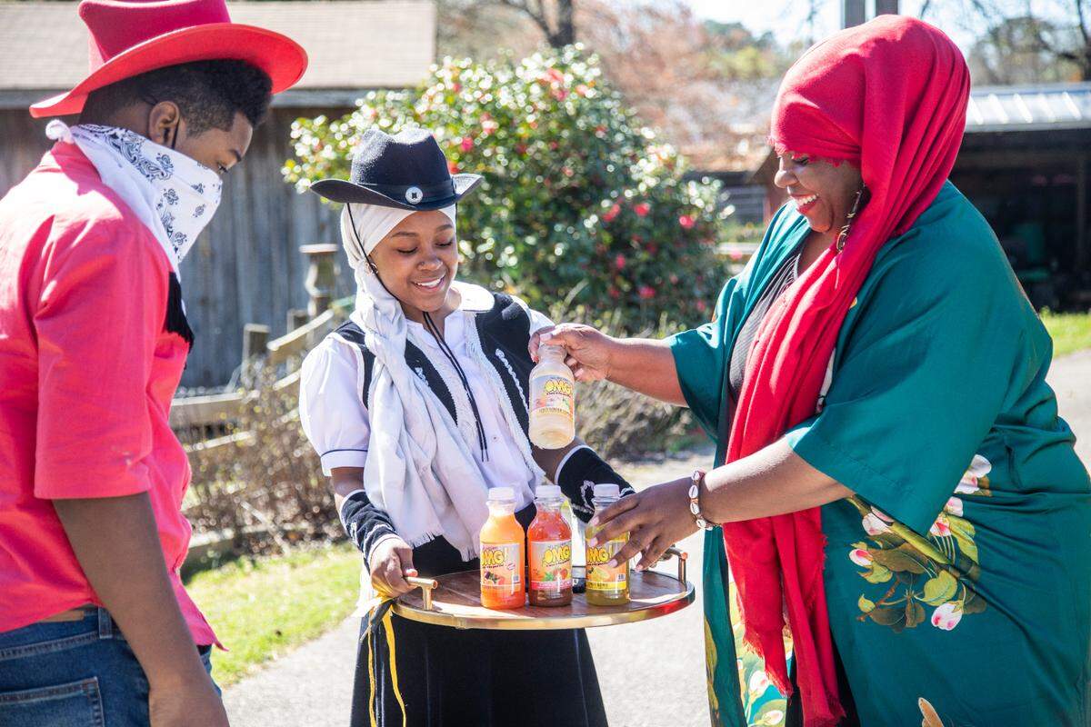 Melita Quick, an entrepreneur from Cary, right, and her daughter Layla, 17, and son Yusus, 13, gets ready for a photoshoot featuring their artisan lemonades named OMG Lemonade Monday, March. 29, 2021 at a farm in Cary.