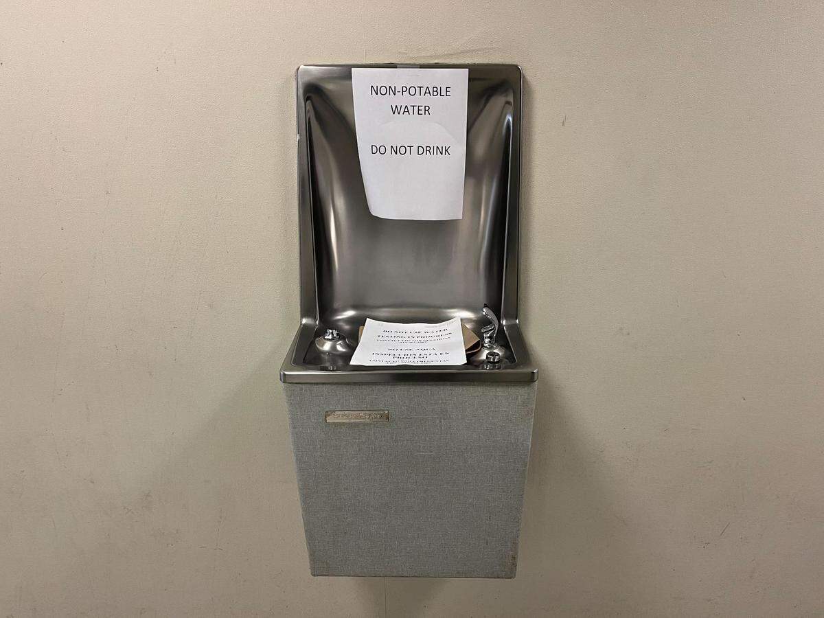 Notices posted on a drinking fountain in Hamilton Hall on the UNC-Chapel Hill campus warns people not to drink the water because testing for lead is underway.