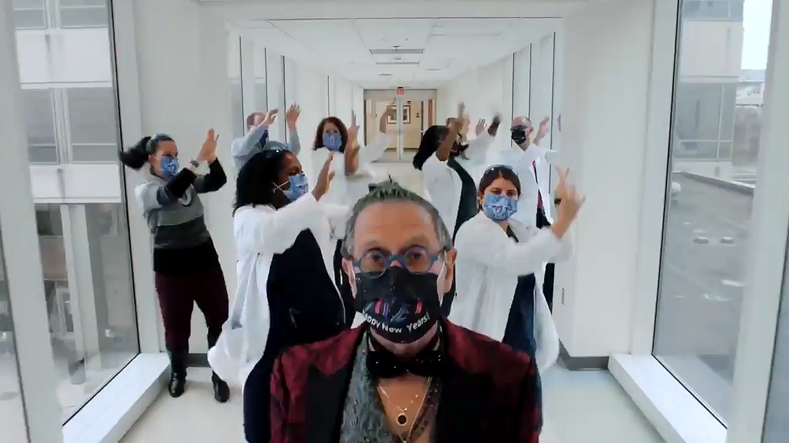 Dr. Stuart Gold leads a team of UNC Children’s Hospital officials dancing through the halls in an end-of-2021 video.