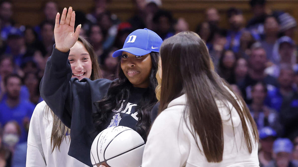 Jaeda Norman, center, waves as she is recognized during a timeout in the Duke men’s basketball game against Lipscomb on Tuesday, Dec. 16, 2025, in Durham, N.C. Dream on 3 organized the opportunity for Norman, who is battling cancer.
