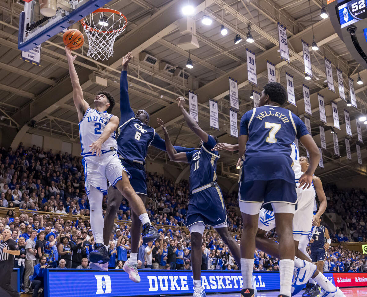 Duke guard Cayden Boozer (2) drives to the basket against Georgia Tech center Mouhamed Sylla (6) in the second half on Wednesday, December 31, 2025 at Cameron Indoor Stadium in Durham, N.C. Cayden Boozer scored 13 points in his first start for the Blue Devils.