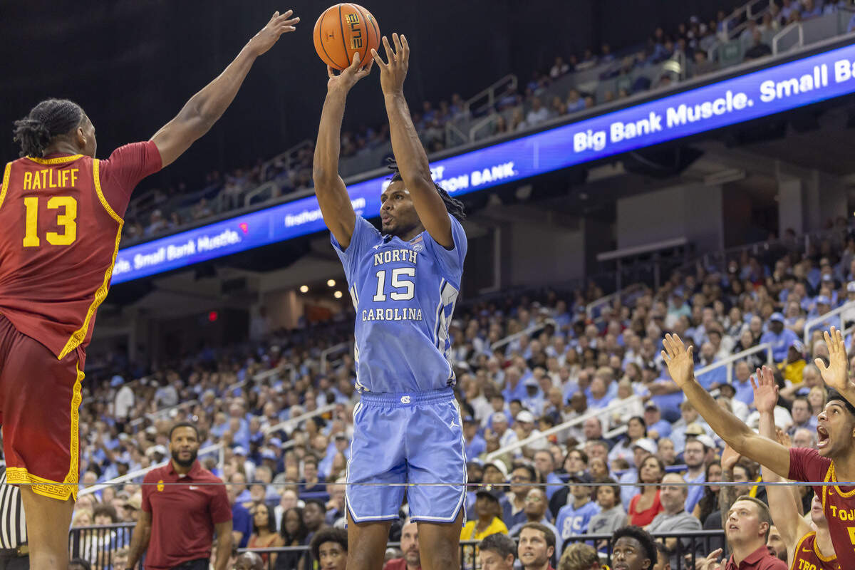 North Carolina forward Jarin Stevenson (15) launches a three-point shot against USC forward Adonis Ratliff (3) in the first half on Friday, Oct. 9, 2026, at the First Horizon Coliseum in Greensboro, N.C. Stevenson led all scorers with 25 points in the Tar Heels’ 88-70 victory.