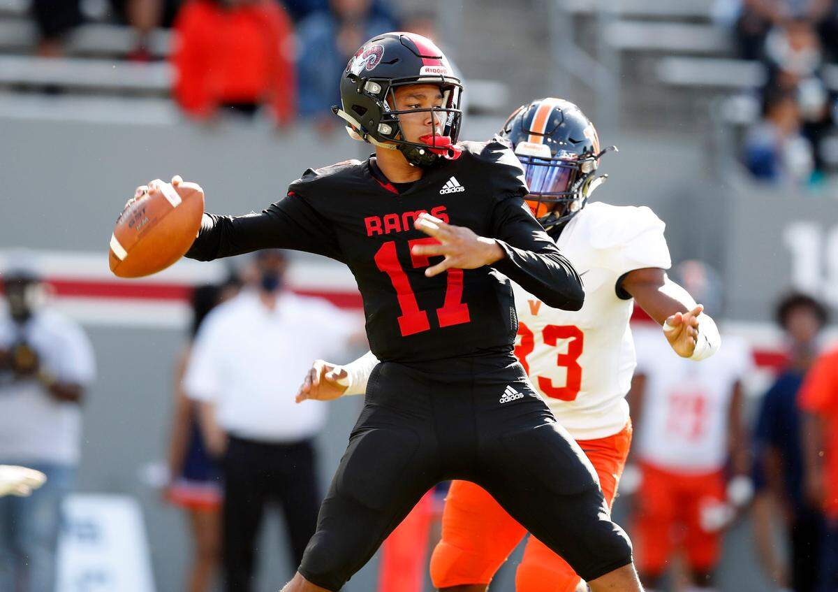 Rolesville’s Byrum Brown (17) prepares to pass during the first half of Rolesville High School’s game against Vance High School in the NCHSAA 4AA state championship at Carter-Finley Stadium in Raleigh, N.C., Saturday, May 8, 2021.