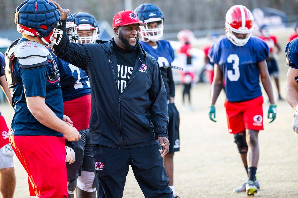 Louisburg College Head Football Coach Quinderra Spellman leads his team during their final practice on Tuesday, Dec. 3, 2004, in Louisburg. The team is heading to the NJCAA National Championship for the first time in the program’s 20-year history.