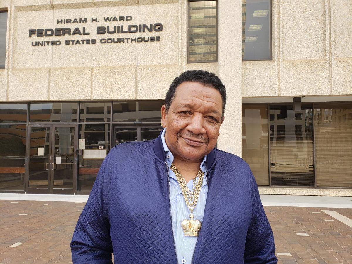 Darryl Howard stands outside the federal courthouse in Winston-Salem after a jury awarded him $8 million after finding that a Durham, North Carolina detective fabricated evidence that led to Howard spending more than two decades in state prison on an arson and double murder charge.