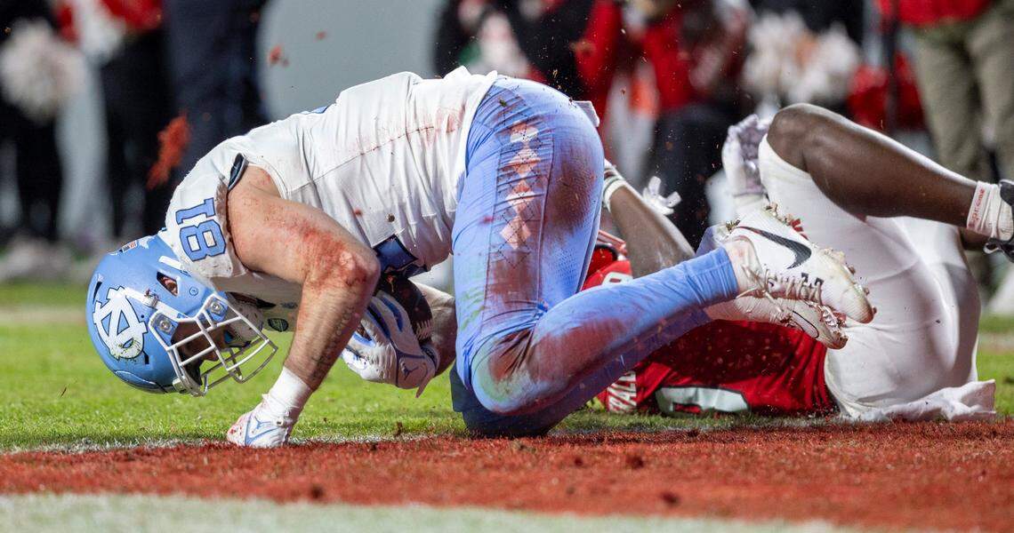 North Carolina’s John Copenhaver (81) scores on a 15-yard pass reception from quarterback Drake Maye in the second quarter against N.C. State on Saturday, November 25, 2023 at Carter-Finley Stadium in Raleigh, N.C.