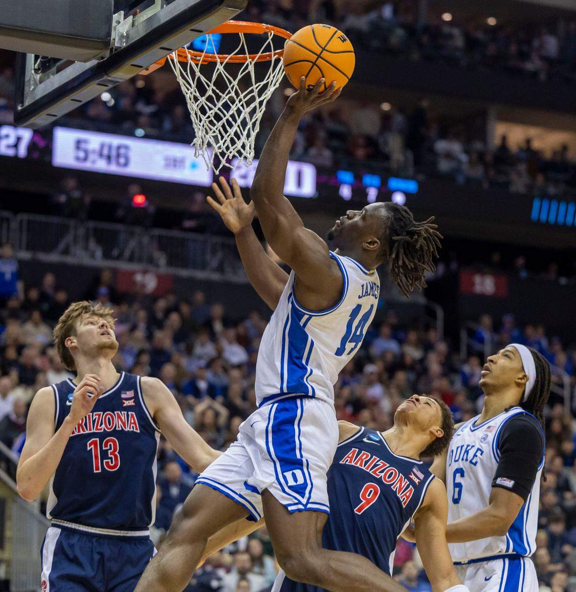 Duke guard Sion James (14) drives to the basket against Arizona’s Henri Veesaar (13) and Carter Bryant (9) in the first half on Thursday, March 27, 2025 during the NCAA Sweet 16 at Prudential Center in Newark, NJ.