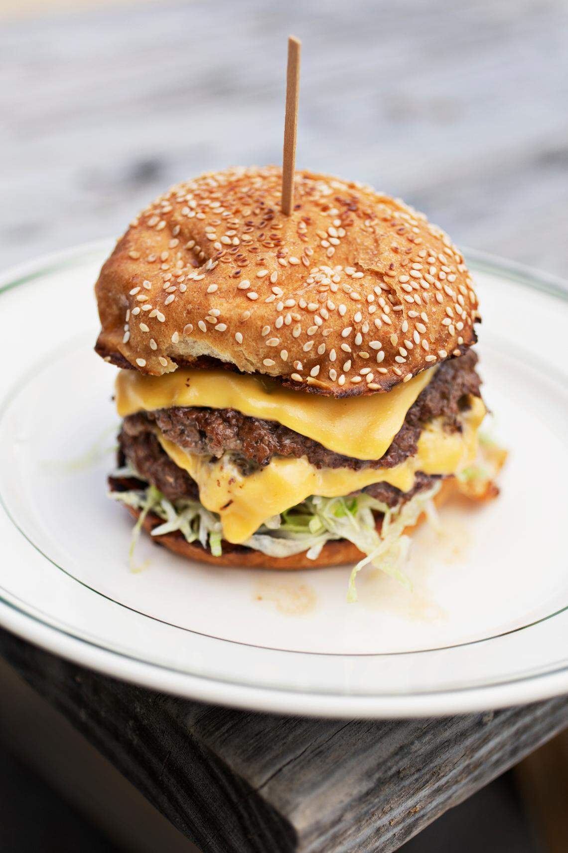 Fine Folk’s Smash Burger in Raleigh is made up of cheese, shredded lettuce, pickle, onion and “fine sauce.”