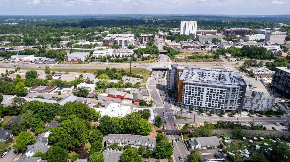 An aerial view of the Smoky Hollow district in Raleigh shows the site where a construction of 30-story tower is being proposed across from a 12-story high-rise that currently houses apartments and Publix near the historic Glenwood-Brooklyn neighborhood bordering the northern edge of downtown Raleigh.