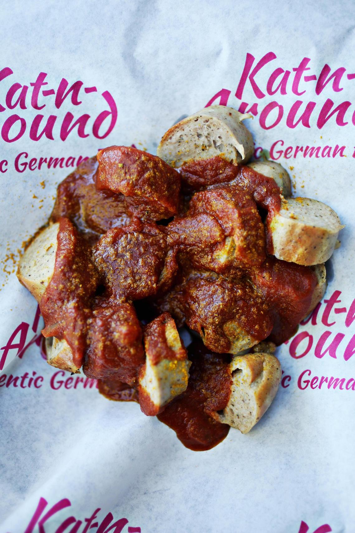 Kat Bierbach’s homemade curry sauce — a piquant and slightly sweet blend of tomato, applesauce, balsamic vinegar, honey, onion and curry powder — is on the money. It is one of several menu items on her German food truck, Kat-n-Around.