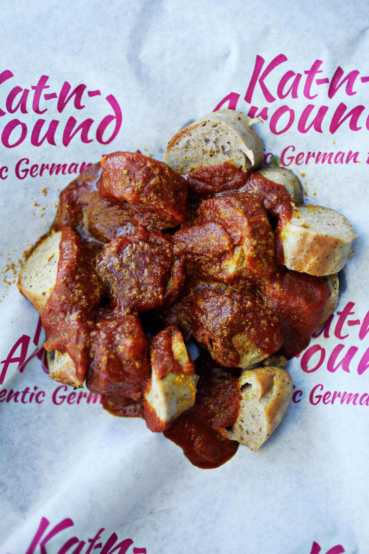 Kat Bierbach’s homemade curry sauce — a piquant and slightly sweet blend of tomato, applesauce, balsamic vinegar, honey, onion and curry powder — is on the money. It is one of several menu items on her German food truck, Kat-n-Around.