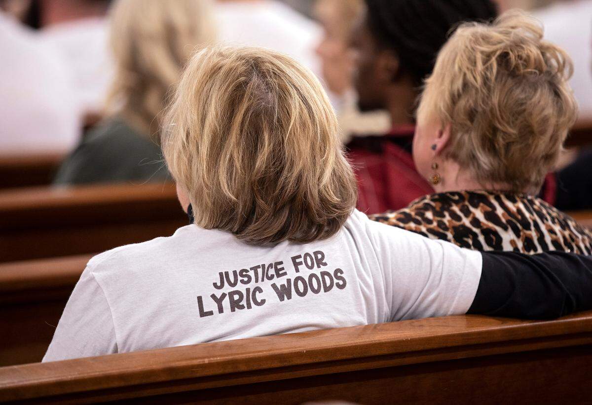 A person wears a T-shirt in support of justice for slain teenager Lyric Woods during a hearing in Hillsborough.