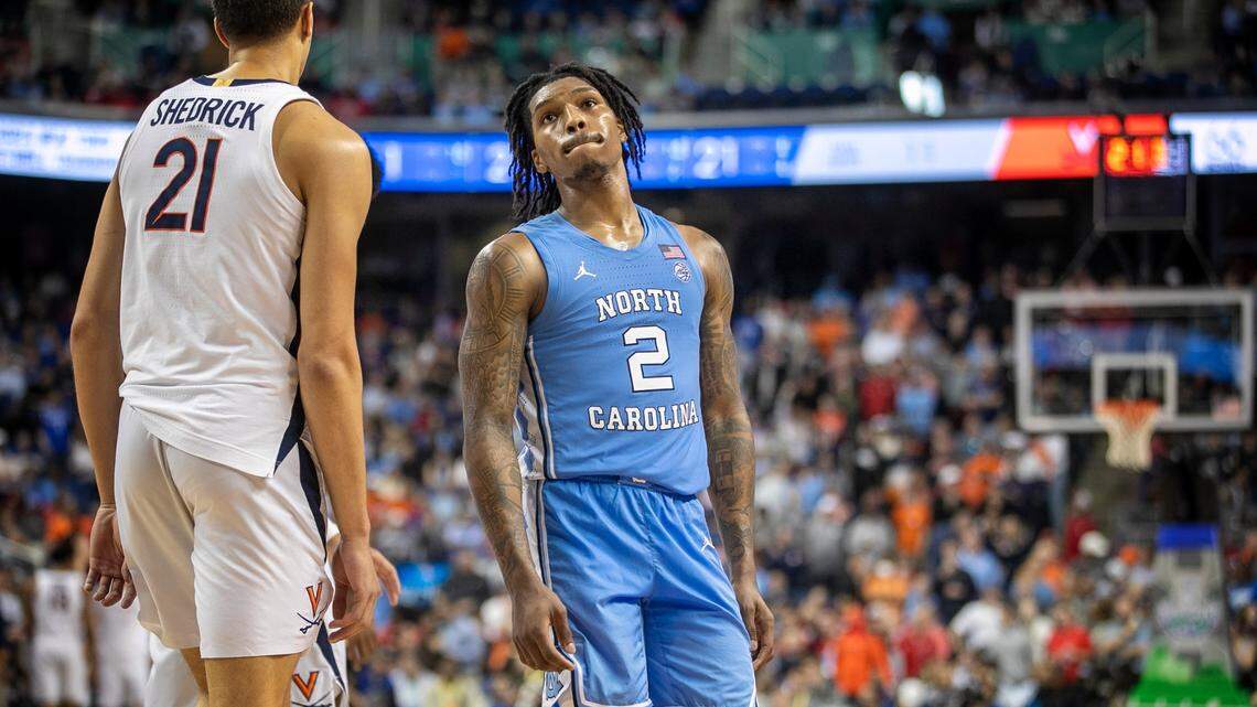 Down by nine points with just seconds to play, North Carolina’s Caleb Love (2) glances at the scoreboard during the third round of the ACC Tournament on Thursday, March 9, 2023 at the Greensboro Coliseum in Greensboro, N.C. Love scored 11 points in the 68-59 loss. 