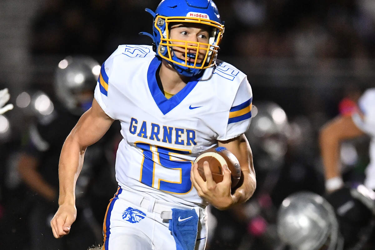 Garner quarterback Christian Ormandy (15) runs for the touchdown against South Garner during the first half. The South Garner Titans and the Garner Trojans met in a conference football game in Raleigh, N.C. October 17, 2025