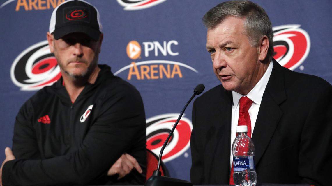 Majority owner Tom Dundon, left, looks on as Don Waddell speaks to reporters after it was announced he would be the team’s new general manager, a position he has held in the interim since Ron Francis’ departure several weeks ago, during a press conference held at PNC Arena in Raleigh on May 9, 2018. It was also announced that former star player and assistant coach Rod Brind’Amour would be the team’s new head coach.