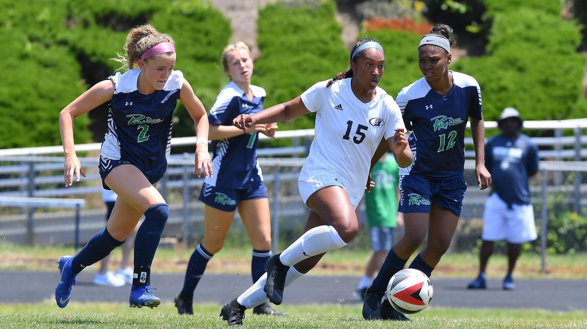 Bri Holt (15) of Heritage looks for a pass against Malina Pardo (2), Savannah Stewart, second from left, and Kristy Campbell (12) of Leesville Road. The Heritage Huskies visited the Leesville Road Pride in a high school girls soccer game on May 18, 2019. Heritage won 2-0.