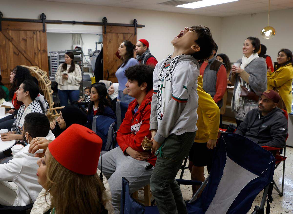 Fans react while watching the second half of the World Cup semifinal match between Morocco and France at La Recette patisserie in Durham, N.C. on Wednesday, Dec. 14, 2022.