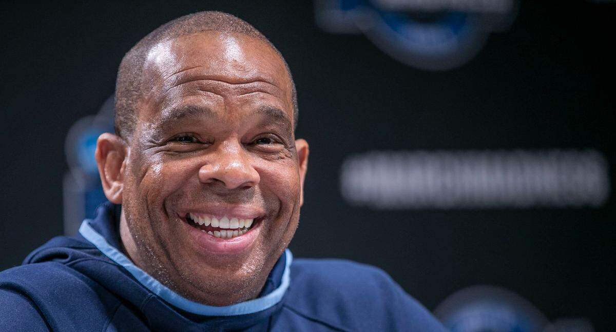 North Carolina coach Hubert Davis smiles as he fields question during a media availability on Thursday, March 24, 2022 at Wells Fargo Center in Philadelphia, Pa.