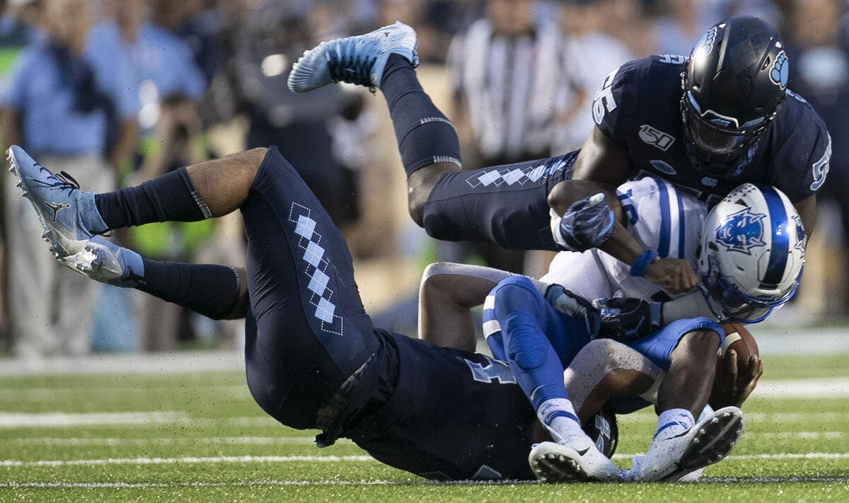 Duke quarterback Quentin Harris (18) is sacked by North Carolina’s Jeremiah Gemmel (44) and Jason Strowbridge (55) for a five yard loss in the third quarter on Saturday, October 26, 2019 at Kenan Stadium in Chapel Hill, N.C.