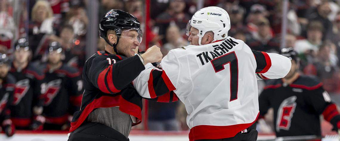 Ottawa left wing Brady Tkachuk (right) mixes it up with Carolina Hurricanes center Jordan Staal in the first period on Saturday, April 18, 2026 during the first round of the Stanley Cup Playoffs at Lenovo Center in Raleigh, N.C.