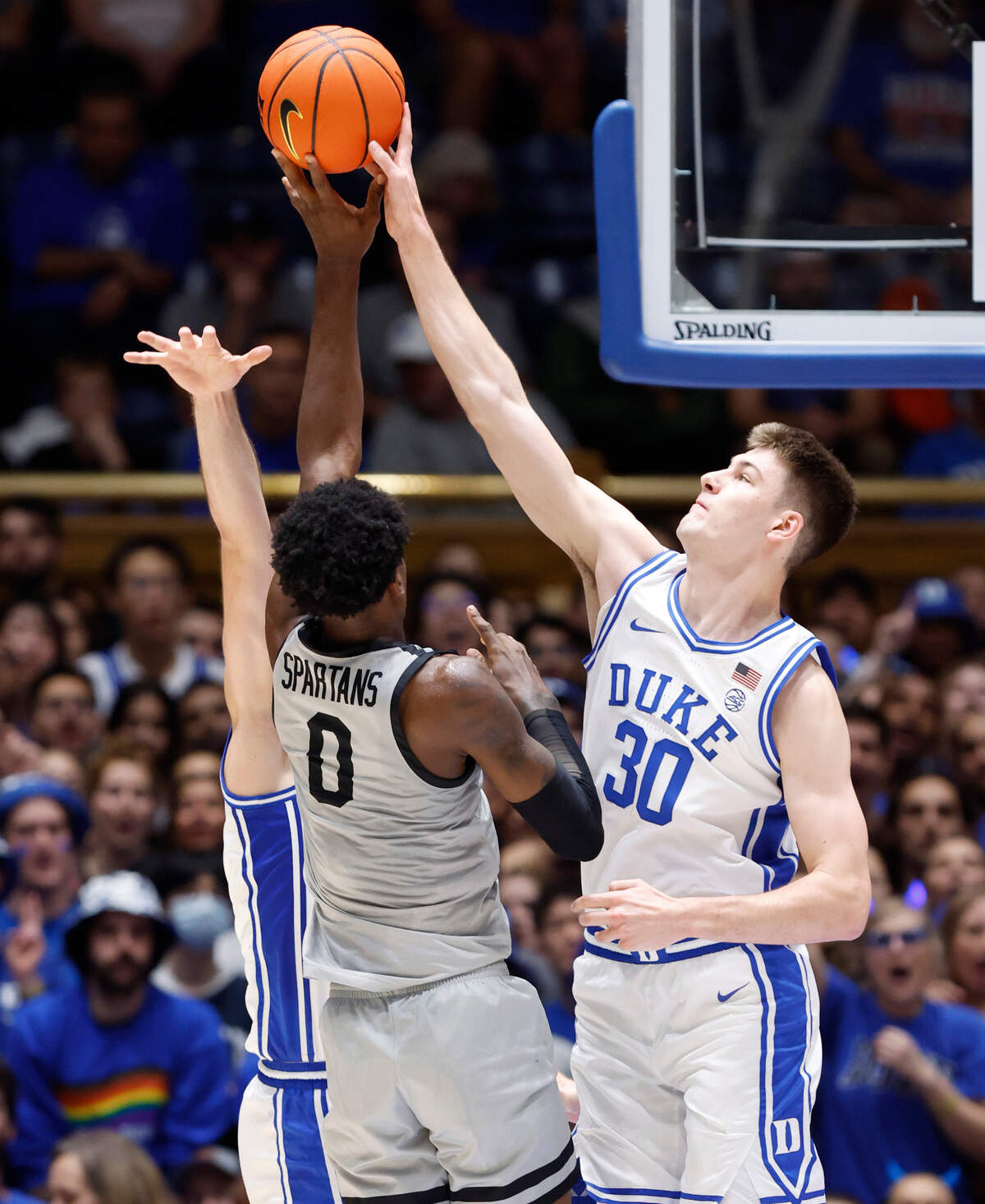Duke’s Kyle Filipowski (30) blocks the shot by USC Upstate’s Khydarius Smith (0) during the first half of Duke’s game against USC Upstate at Cameron Indoor Stadium in Durham, N.C., Friday, Nov. 11, 2022.