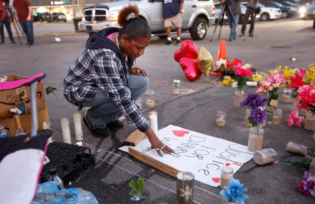 “I love you. We got your back” says Mary Cabell, Darryl Williams’ aunt before a vigil for Williams outside Supreme Sweepstakes in Raleigh, N.C., Thursday evening, Jan. 19, 2023. Williams, 32, died after he was tased by Raleigh police officers Tuesday morning.