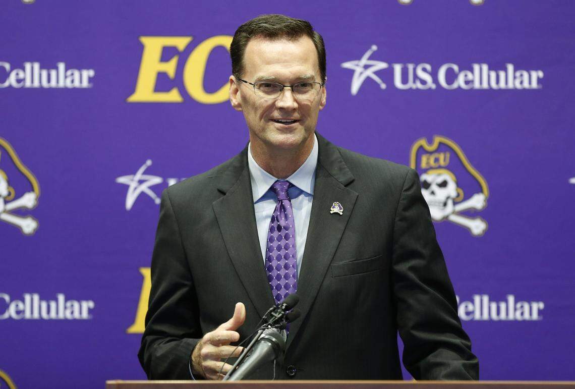 East Carolina athletic director Jon Gilbert talks before introducing Mike Houston as head football coach during a press conference at the Murphy Center at East Carolina University in Greenville, N.C., Tuesday, Dec. 4, 2018.