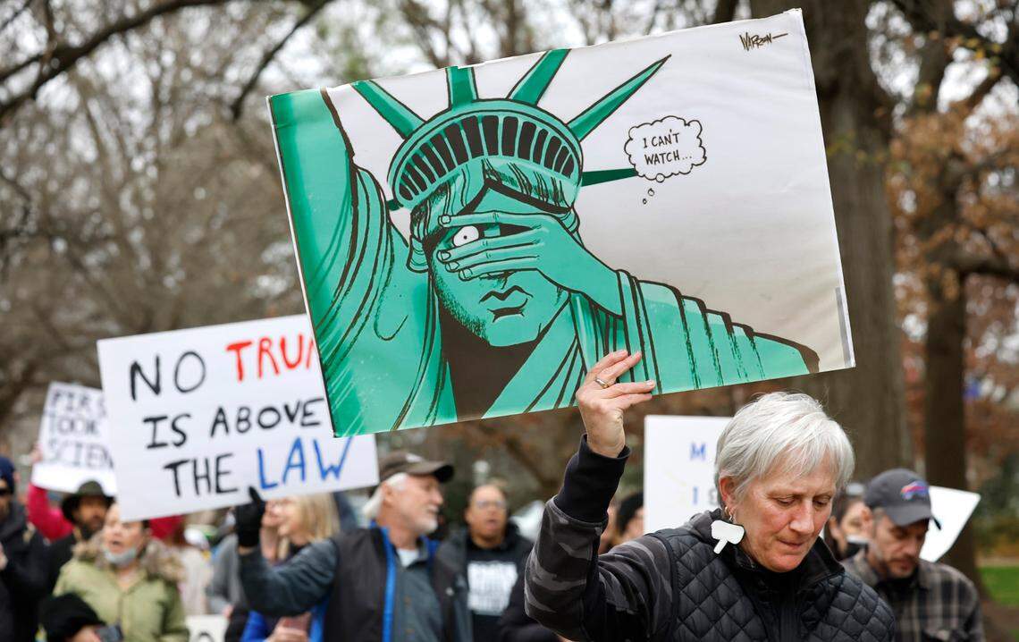 Susan Jones of Durham is one of the over 1000 protesters who marched around the North Carolina State Capitol building on Wednesday Feb. 5, 2025. The protest was part of a nationwide series of demonstrations in state capitals against the new administration of President Donald Trump.