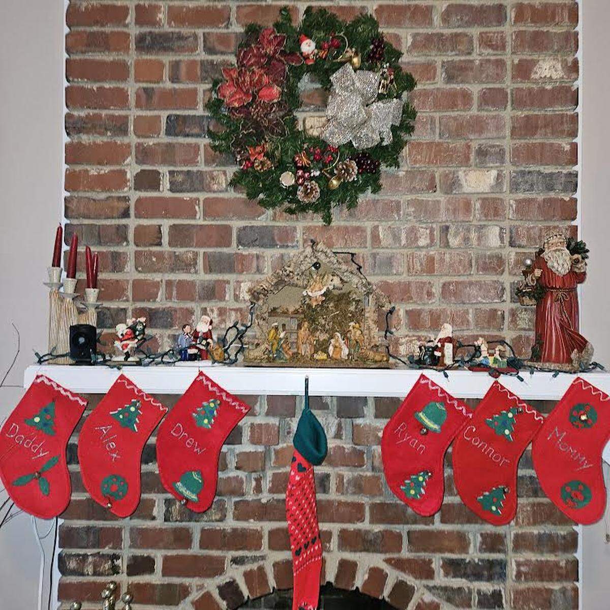 The Baldy family mantel, including stockings for their four sons.