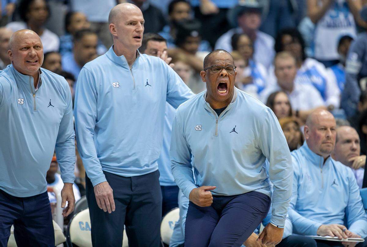 North Carolina coach Hubert Davis works to motivate his team on defense in the first half against Duke on Saturday, March 4, 2023 at the Smith Center in Chapel Hill, N.C.