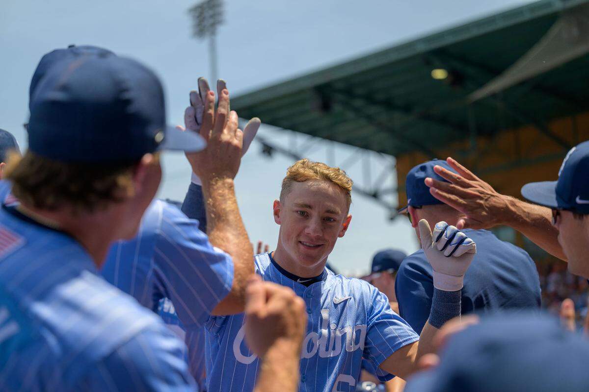 UNC second baseman Jackson Van De Brake high fives teammates during the ACC baseball championship game on Sunday, May 25, 2025, at Durham Bulls Athletic Park in Durham, N.C.