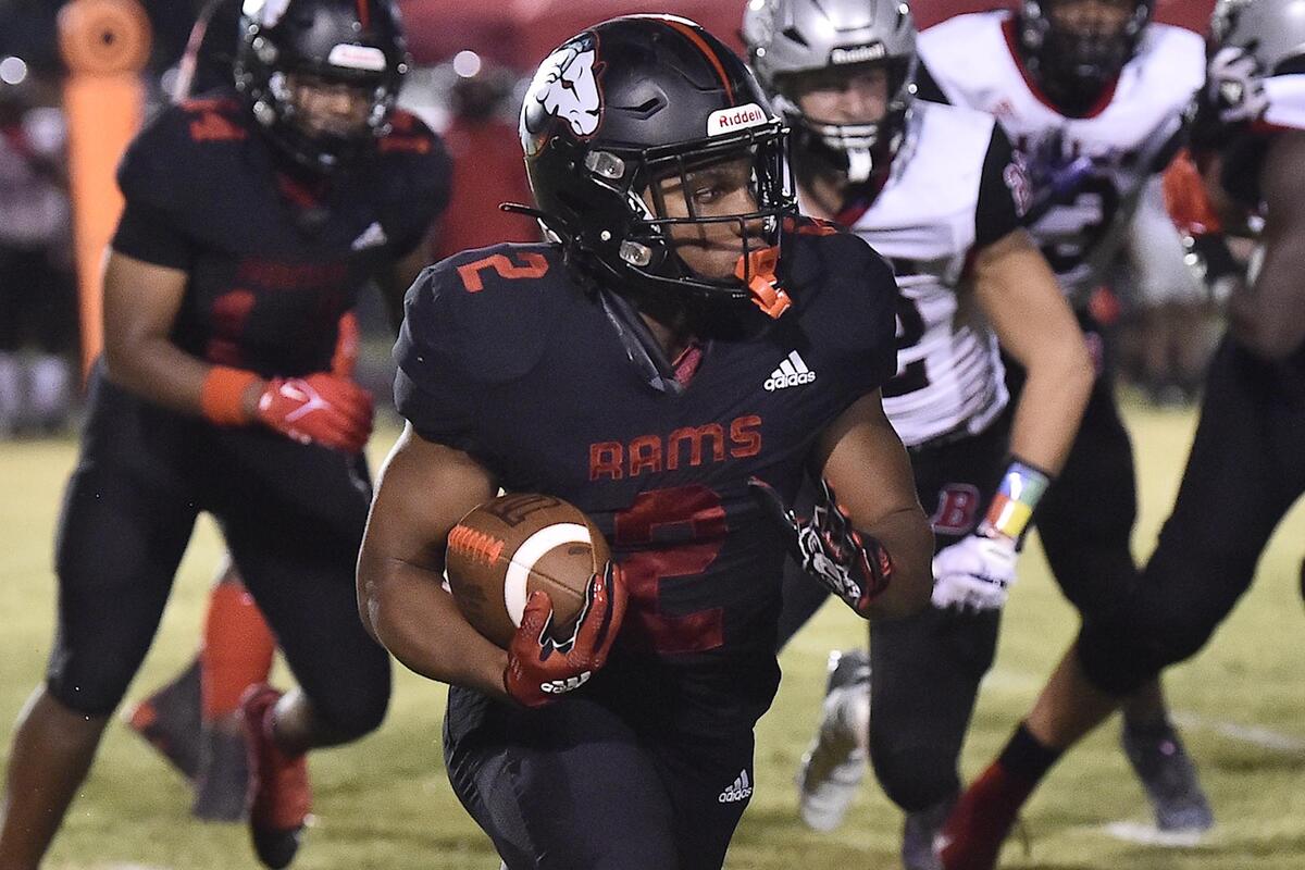 Rolesville’s Isiah Jones (2) runs for yardage against Butler during the second half. The Rolesville Rams and the Butler Bulldogs met in a non-conference football game in Rolesville N.C. on August 18, 2023.