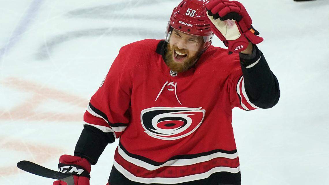 Carolina Hurricanes defenseman Jani Hakanpaa (58) reacts following his game-winning goal against the Nashville Predators during the third period of an NHL hockey game in Raleigh, N.C., Saturday, April 17, 2021. (AP Photo/Gerry Broome)