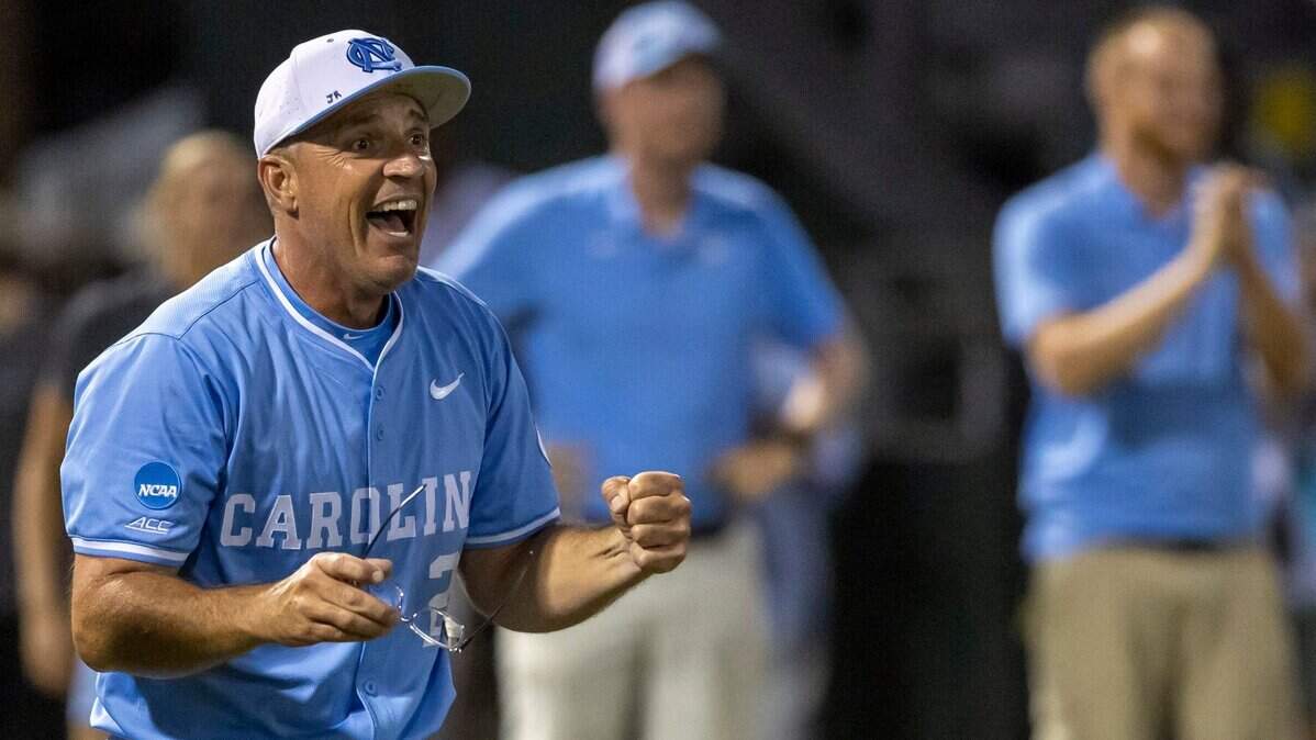 North Carolina coach Scott Forbes watches his players as they celebrate their 2-1 victory over West Virginia, clinching the Super Regional and advancing to the College World Series on Saturday, June 8, 2024 at Boshamer Stadium in Chapel Hill, N.C.