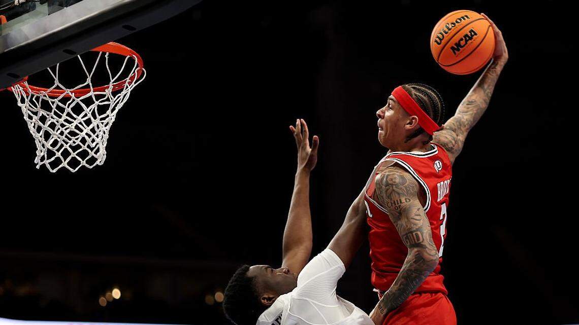 KANSAS CITY, MISSOURI - MARCH 10: Terrence Brown (2) of the Utah Utes goes up for a dunk as Tyler McKinley (24) of the Cincinnati Bearcats defends during the first round game of the Men's 2026 Big 12 Tournament at T-Mobile Center on March 10, 2026 in Kansas City, Missouri.