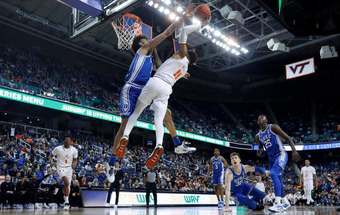 Duke’s Dereck Lively II (1) blocks the shot by Miami’s Jordan Miller (11) during Duke’s 85-78 victory over Miami in the semifinals of the ACC Men’s Basketball Tournament in Greensboro, N.C., Friday, March 10, 2023.