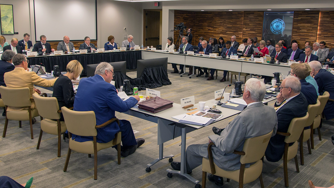 Members of the UNC System Board of Governors gather for a meeting in May 2019.