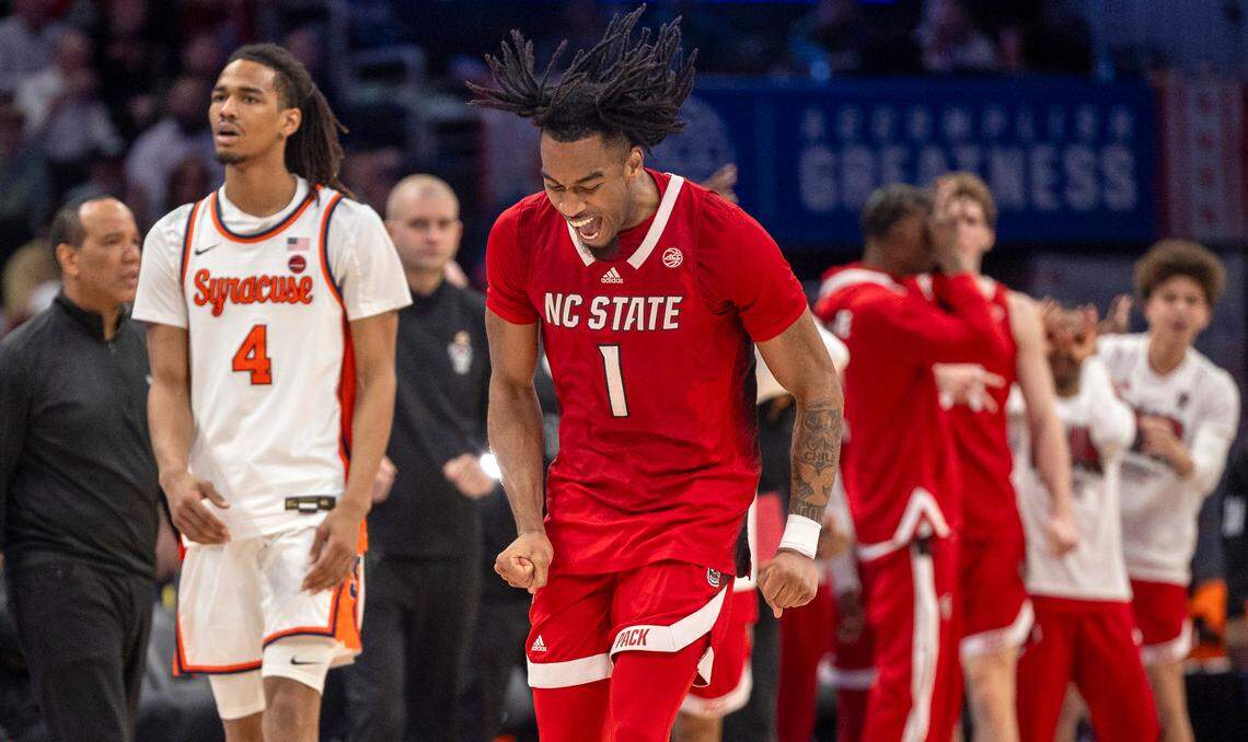 N.C. State’s Jayden Taylor (1) reacts after sinking a three-point basket to give the Wolfpack a 46-39 lead over Syracuse in the second half during the ACC Men’s Basketball Tournament at Capitol One Arena on Wednesday, March 13, 2024 in Washington, D.C. Taylor scored 18 points in the Wolfpack’s 83-65 victory.
