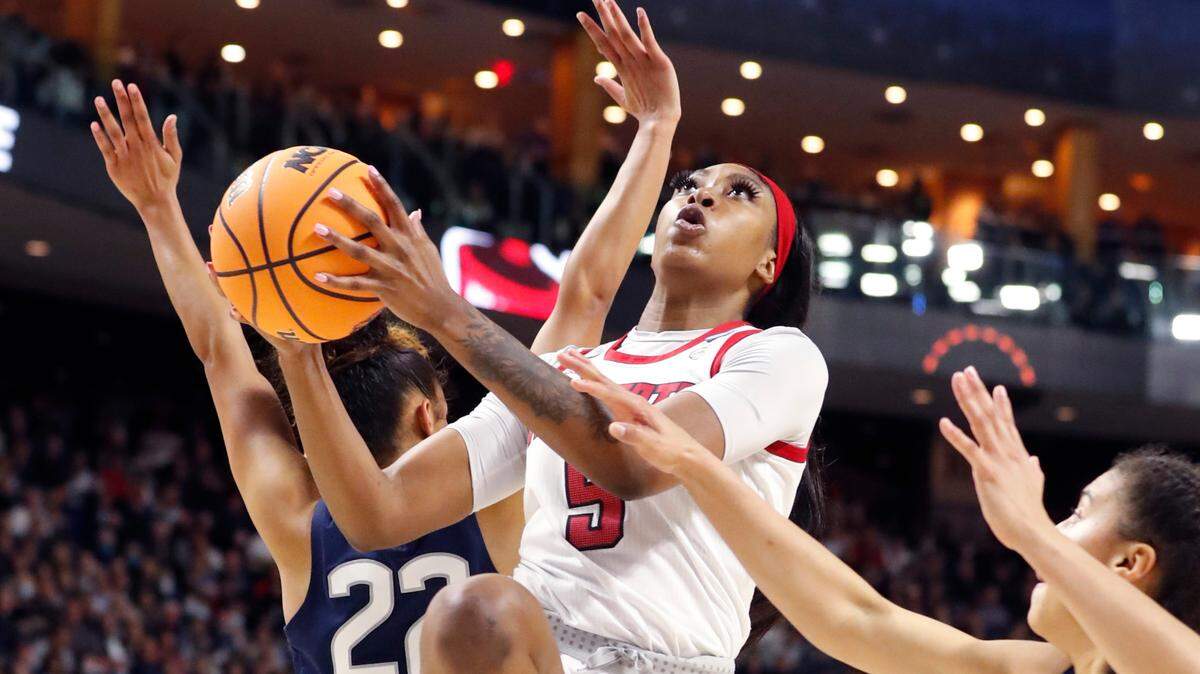 N.C. State’s Jada Boyd (5) drives to the basket during the first half of N.C. State’s game against the University of Connecticut in the Bridgeport Regional final at Total Mortgage Arena in Bridgeport, Conn., Monday, March 28, 2022.