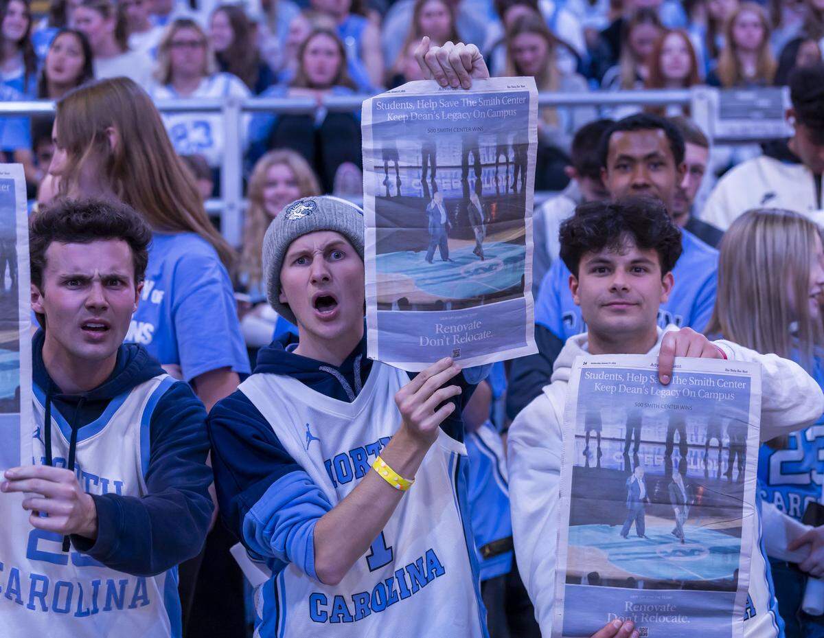 North Carolina fans in the student section hoist copies of The Daily Tar Heel, promoting the concept of renovating the Dean E. Smith Center on Wednesday, January 21, 2026 during the Tar Heels’ game against Notre Dame in Chapel Hill, N.C.