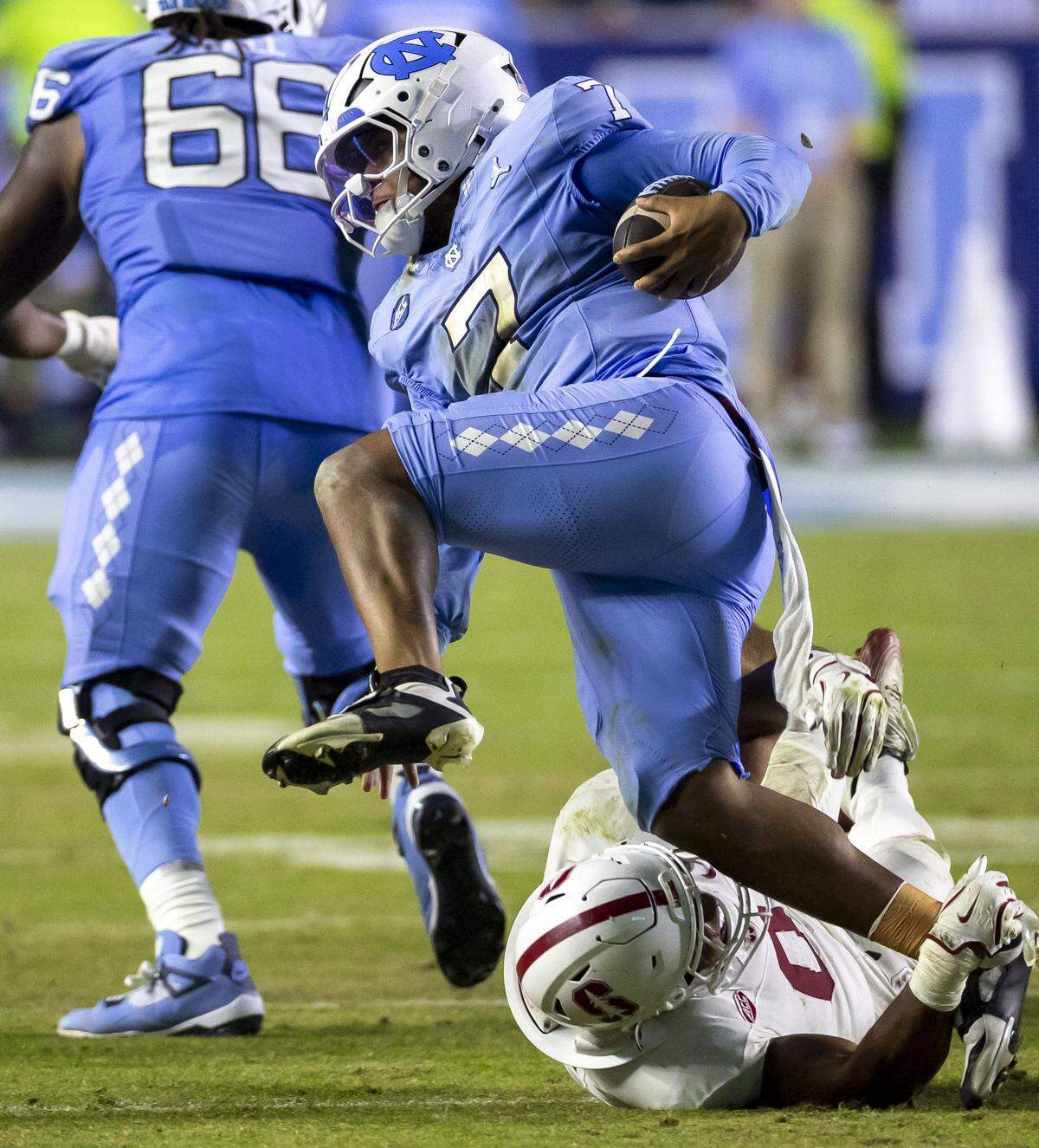 Stanford linebacker Jahsiah Galvan (0) stops North Carolina quarterback Gio Lopez (7) for a four yard loss in the fourth quarter on Saturday, November 8, 2025 at Kenan Stadium in Chapel Hill, N.C.