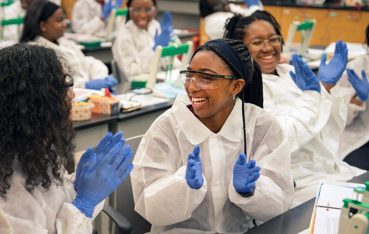 Sydnie Mason laughs with her lab partner at the SNC GlaxoSmithKline Summer Immersion Experience in Biotech, a biotechnology summer program for 11th and 12th graders held by NC Central University in Durham, N.C. on Friday, July 18, 2025.
