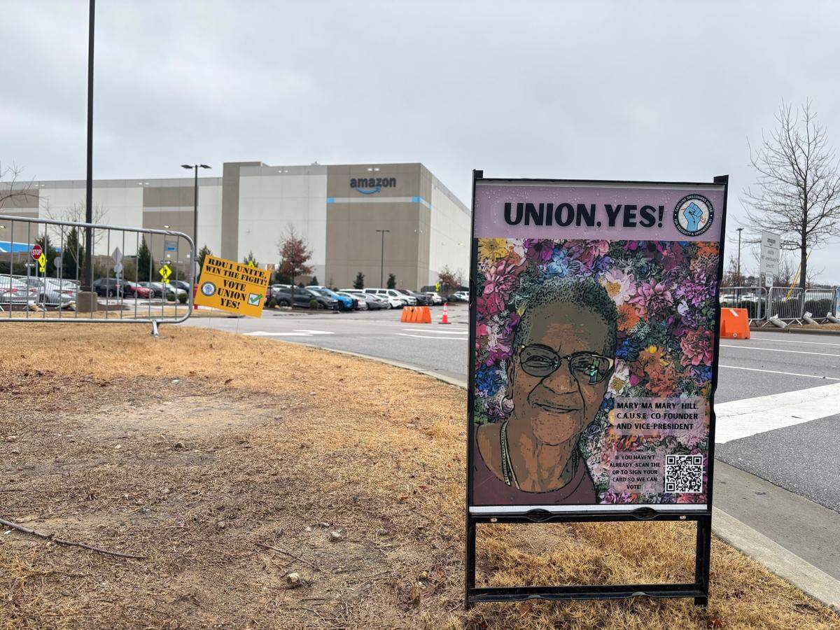A poster outside Amazon’s RDU1 fulfillment center in Garner, North Carolina encourages workers to vote for the union during a week-long election, which ends Feb. 15.