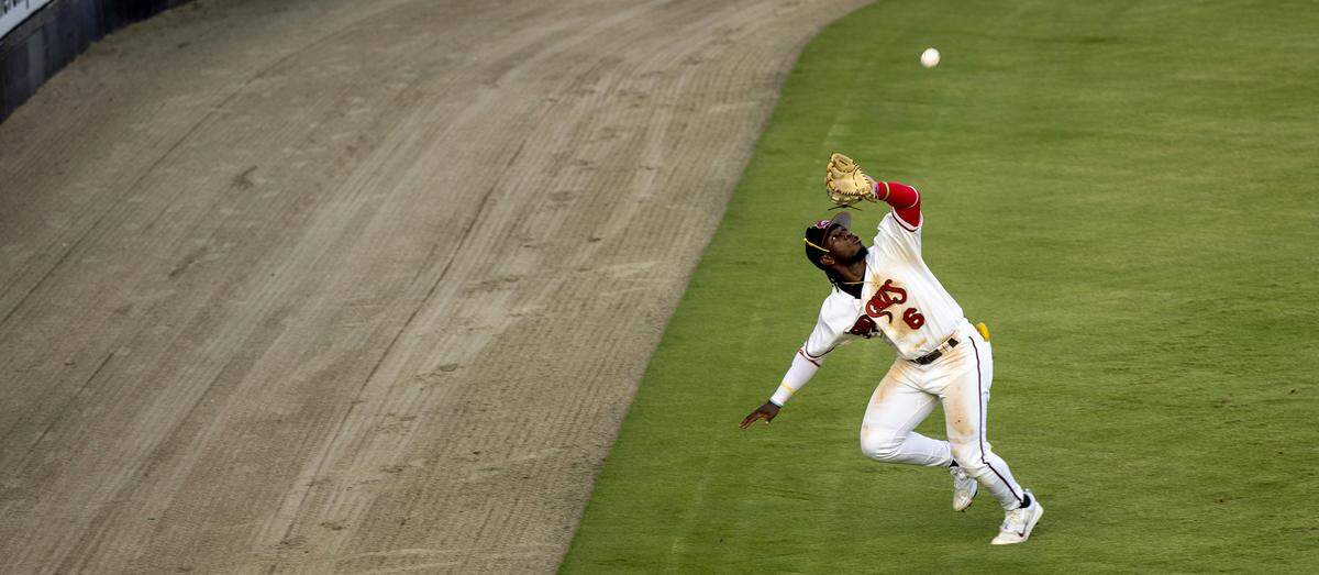 Carolina Mudcats outfielder Pedro Ibarguen (6) catches a fly ball during a recent game against the Kannapolis Cannon Ballers at Five County Stadium in Zebulon, N.C. This is the Mudcats’ 35th and final season in Zebulon.