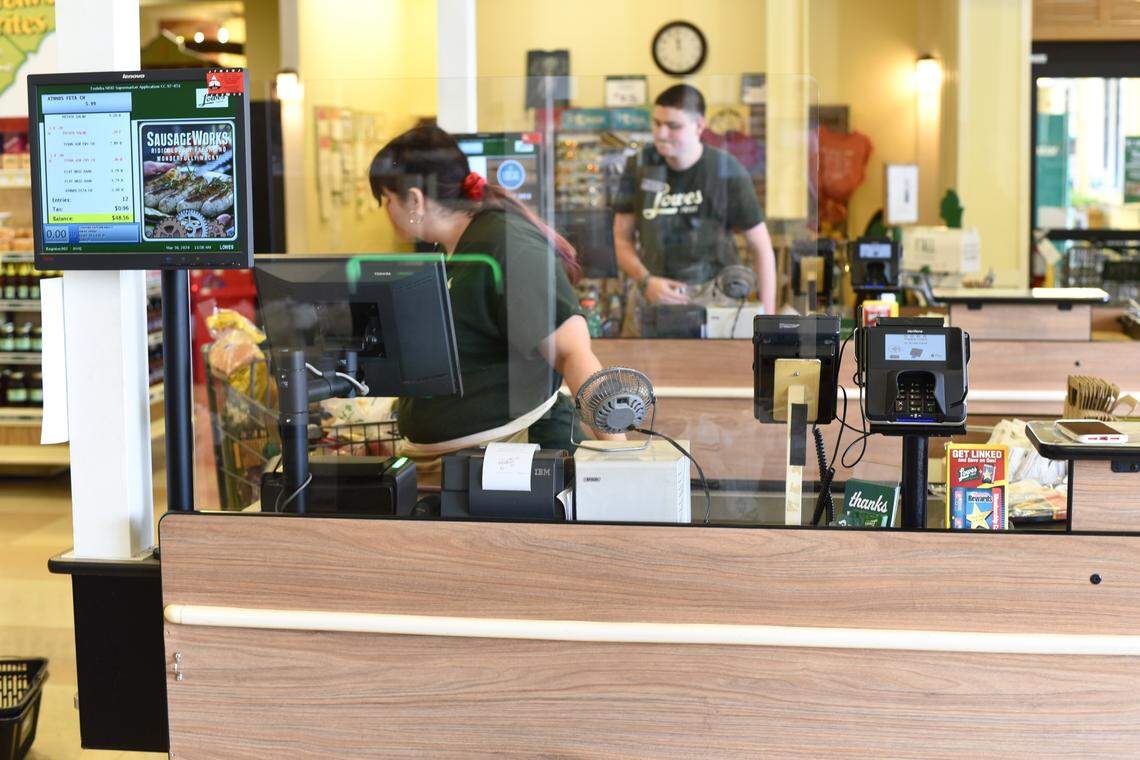 Lowes Foods has installed plexiglass shields at customer checkout stands to help stop the spread of COVID-19 coronavirus.