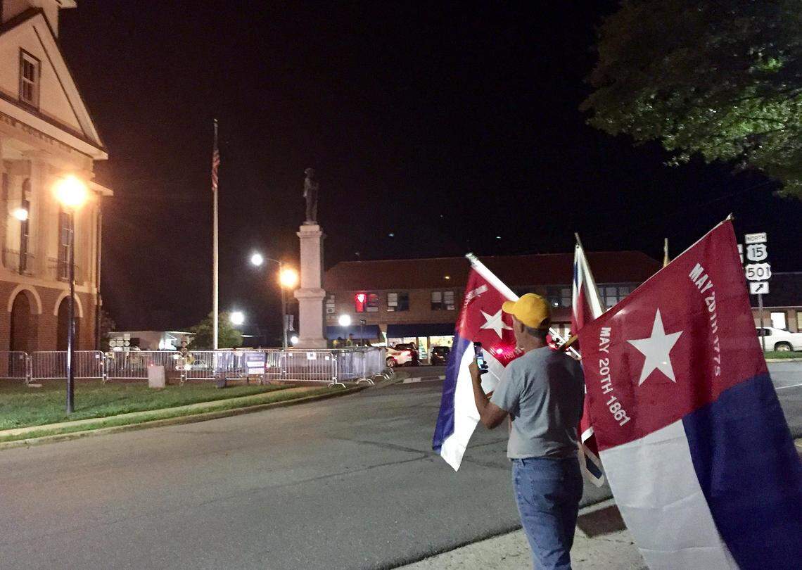 Confederate statue supporters rallied Monday in front of the Historic Chatham County Courthouse following a county commissioners decision to give the United Daughters of the Confederacy until Oct. 1 to come up with a plan for moving the monument.
