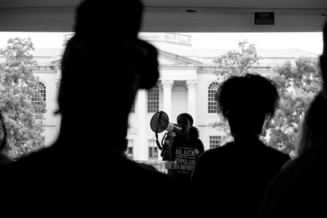 Julia Clark, Vice President of the Black Student Movement at The University of North Carolina at Chapel Hill, leads a demonstration on campus to protest the University decision not to give Nikole Hannah-Jones tenure. Their demands included tenure for Nikole Hannah-Jones, more diversity on the board of trustees, a memorial for James Cates Jr., protection for the Unsung Founders Memorial, and safety for Black students on campus.