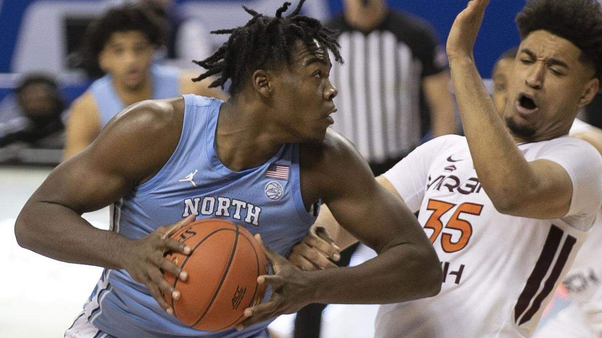 North Carolina’s Day’Ron Sharpe (11) is called for a charge after a collision with Virginia Tech’s Cordell Pemsl (35) during the second half on Thursday, March 11, 2021 during the ACC Tournament at the Greensboro Coliseum in Greensboro, N.C.