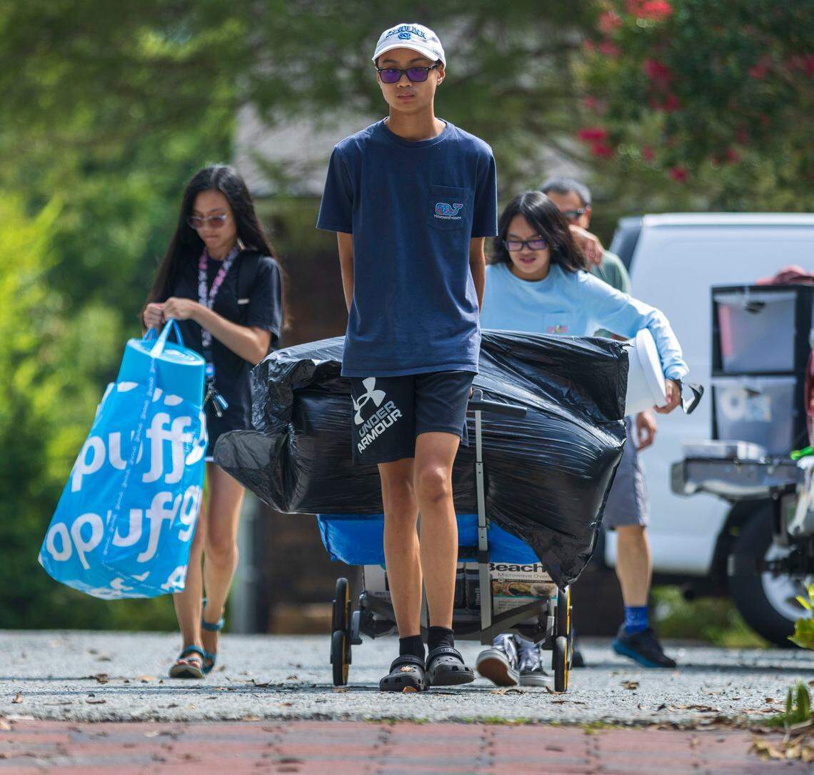 Jason Sobremonte helps his sister Clarisse Sobremonte move into Alderman Residence Hall for the upcoming school year on Thursday, August 4, 2022 at the University of North Carolina in Chapel Hill, N.C. Clarisse Sobremonte, a rising junior, arrived on campus early for training as an office assistant in the housing department.